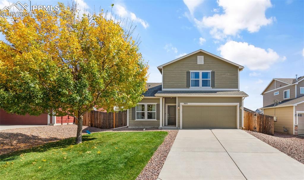 Image 1 of 25: Two-story residence featuring a two-car garage, concrete driveway, and a fr