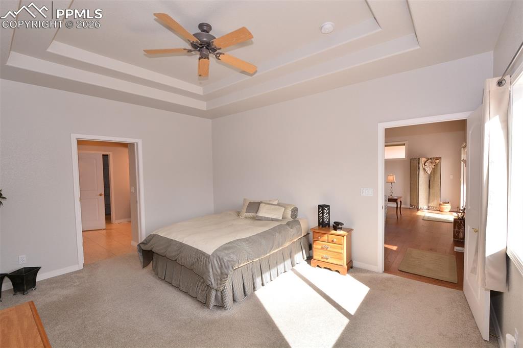 Image 20 of 50: 2nd view of primary bedroom on main level