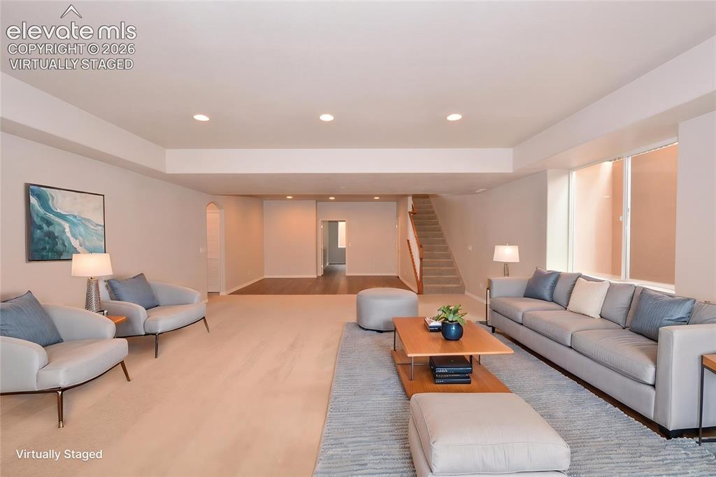 Image 22 of 33: virtually staged basement rec/family room