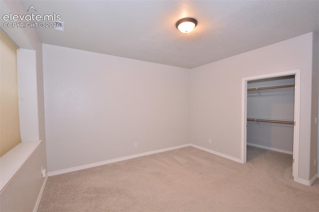 Image 26 of 33: basement bedroom