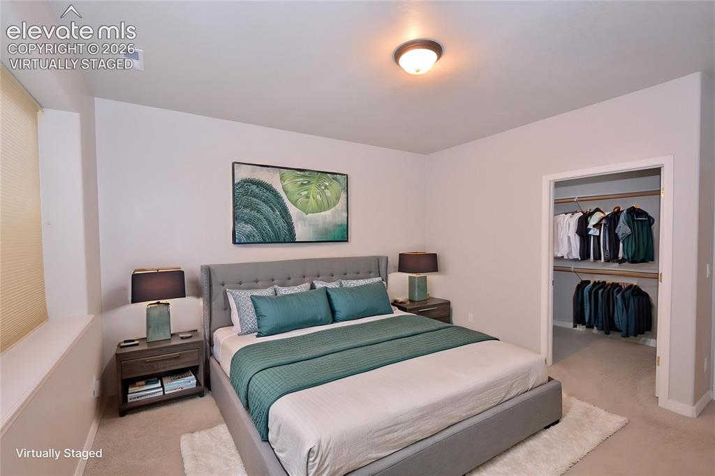 Image 27 of 33: virtually staged basement bedroom
