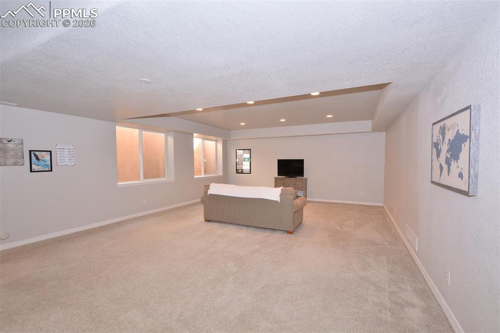 Image 28 of 50: Rec room in full garden level basement