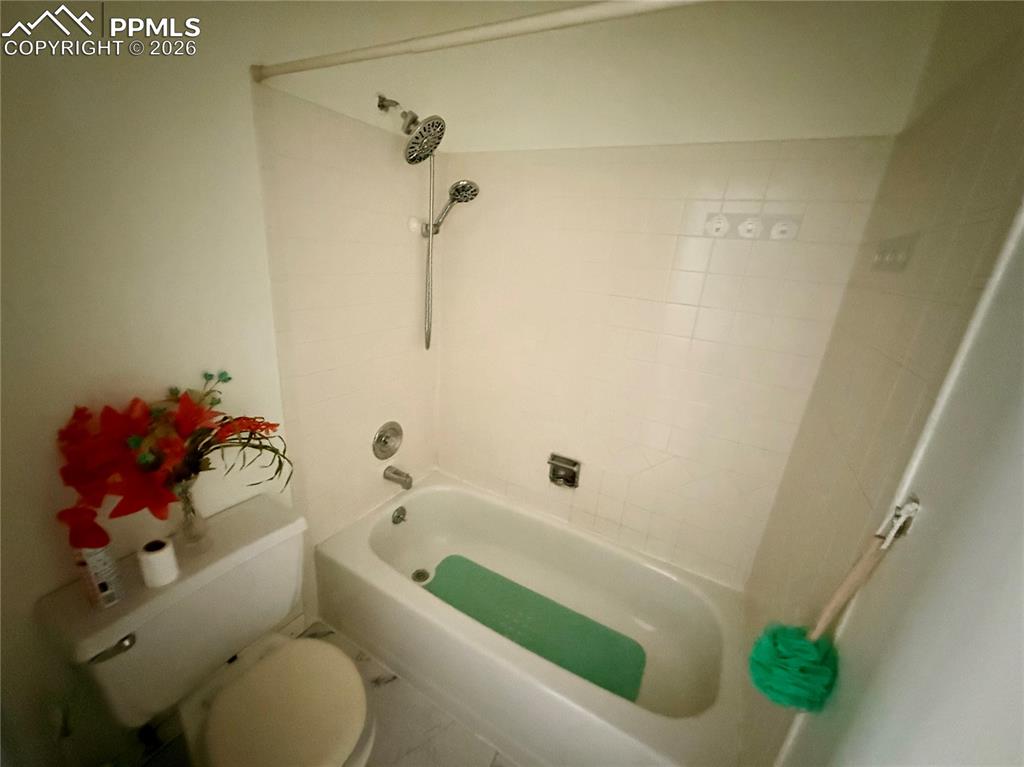 Image 16 of 42: Full bathroom with toilet and shower / tub combination