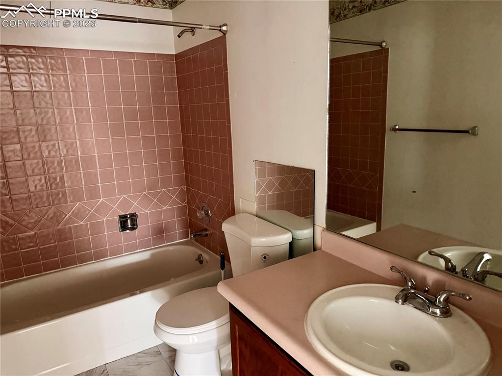 Image 18 of 42: Full bathroom with shower / bath combination and vanity