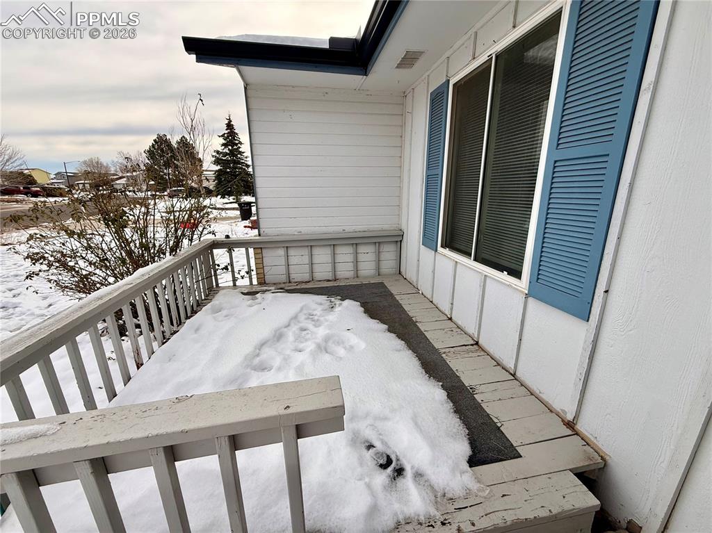 Image 2 of 42: View of snow covered deck