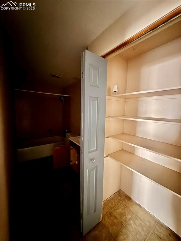 Image 30 of 42: Basement Storage