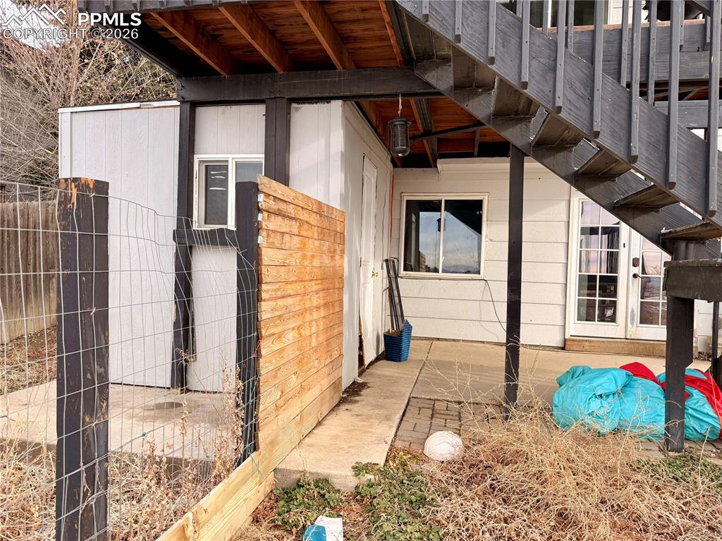 Image 42 of 42: View of side of property featuring a patio area
