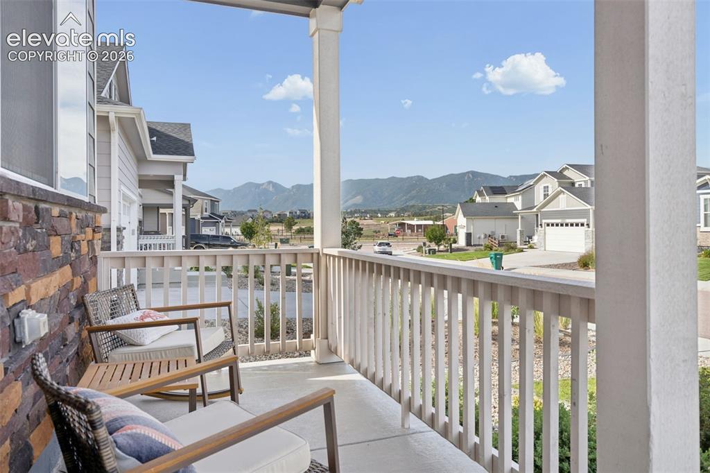 Image 4 of 47: Front porch for morning coffee or evening chats