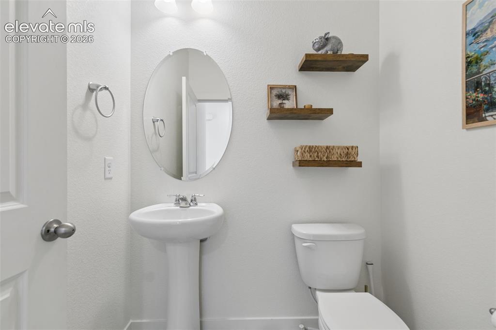 Image 6 of 47: First level powder room adjacent to office