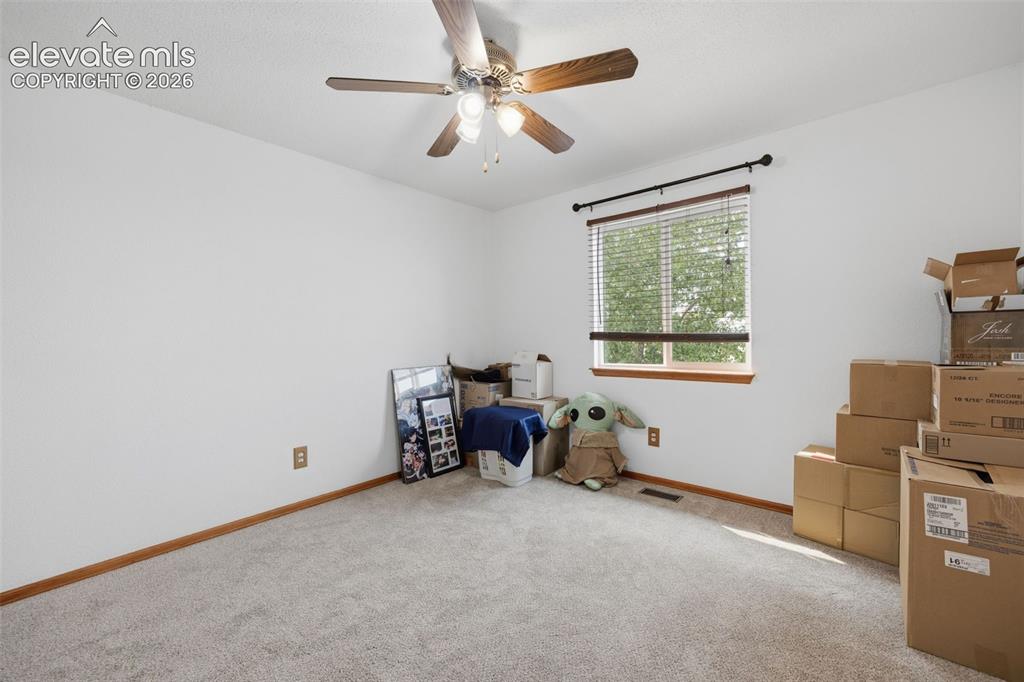 Image 12 of 27: Primary Bedroom featuring a ceiling fan with integrated lighting, purple wa