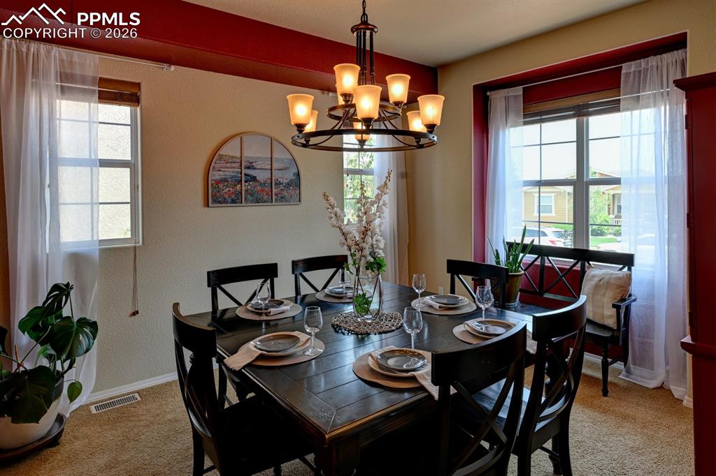 Image 10 of 33: Formal dining space ideal for gatherings both large and small