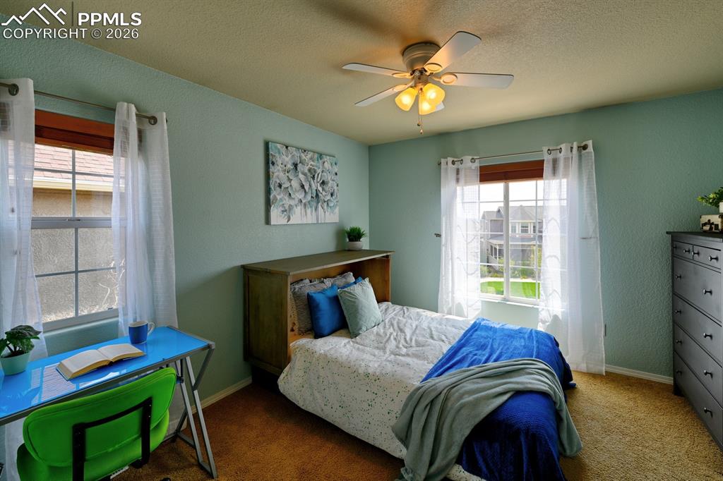 Image 21 of 33: Bright secondary bedroom with comfortable layout and natural light