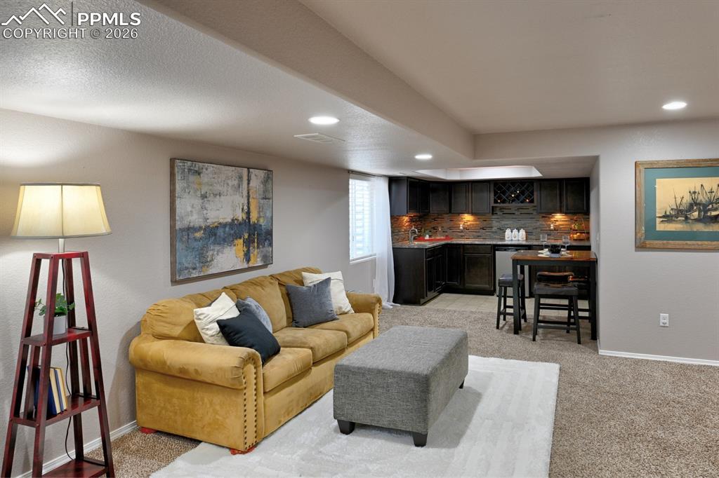 Image 25 of 33: Alternate view of basement family room with open layout
