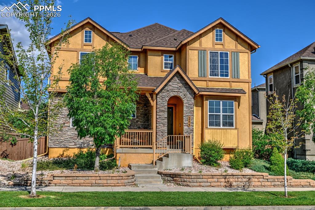 Image 33 of 33: Welcoming front exterior with classic modern Tudor charm