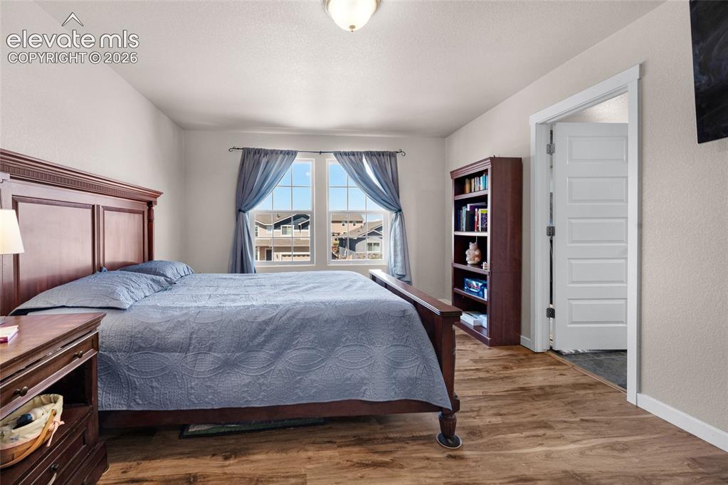 Image 20 of 47: Primary bedroom has front yard views