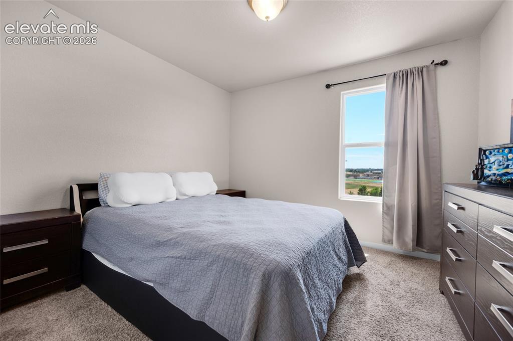 Image 24 of 47: 2nd bedroom is carpeted