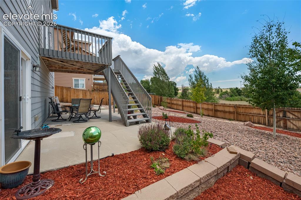 Image 43 of 47: Back yard is xeriscaped too. But there is a sprinkler system below landscap