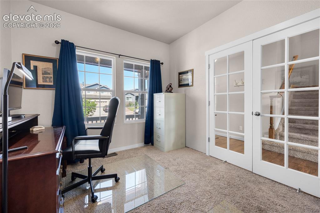 Image 5 of 47: Large window and french doors add very nice atmosphere