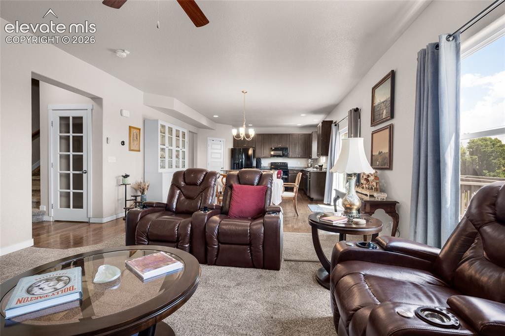 Image 8 of 47: Large window has great views of open space behind home