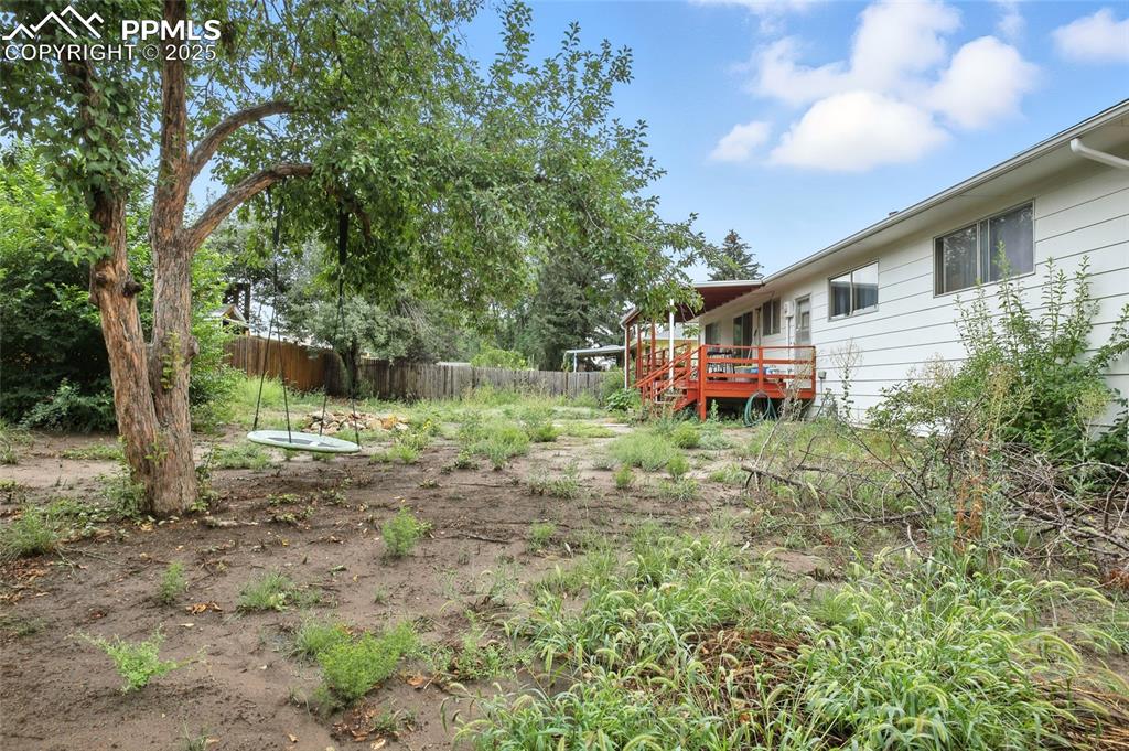 Image 35 of 35: View of yard featuring a deck