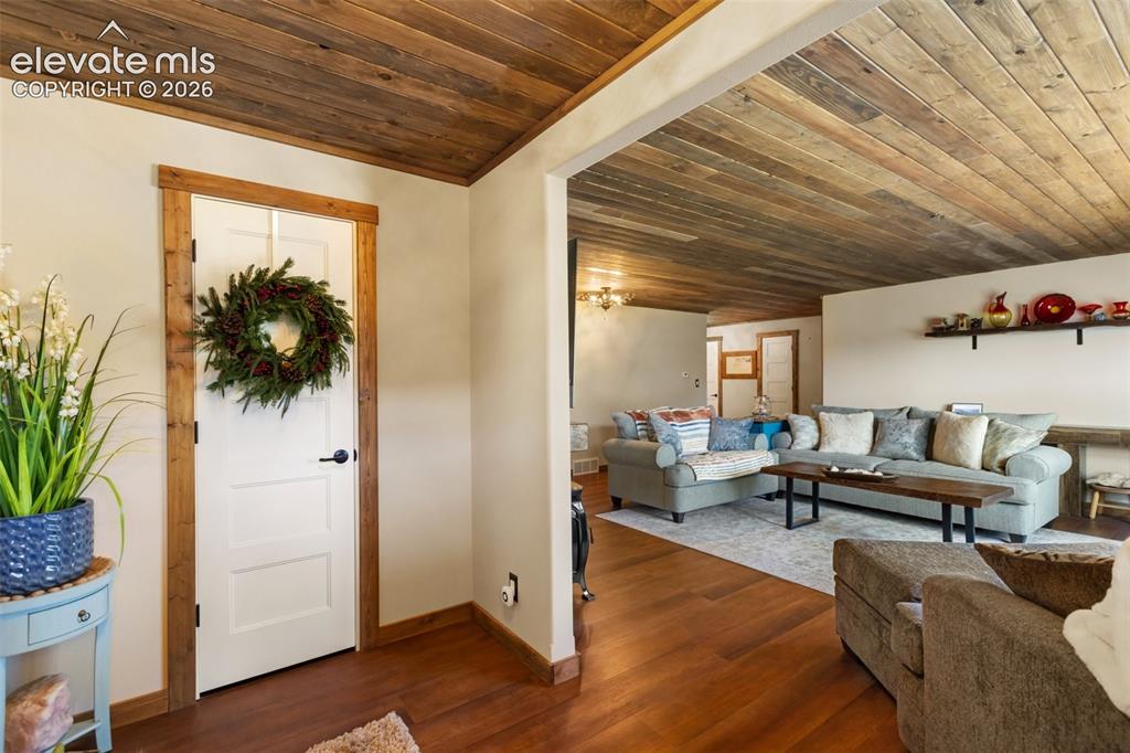 Image 10 of 50: Foyer entry into living room. 