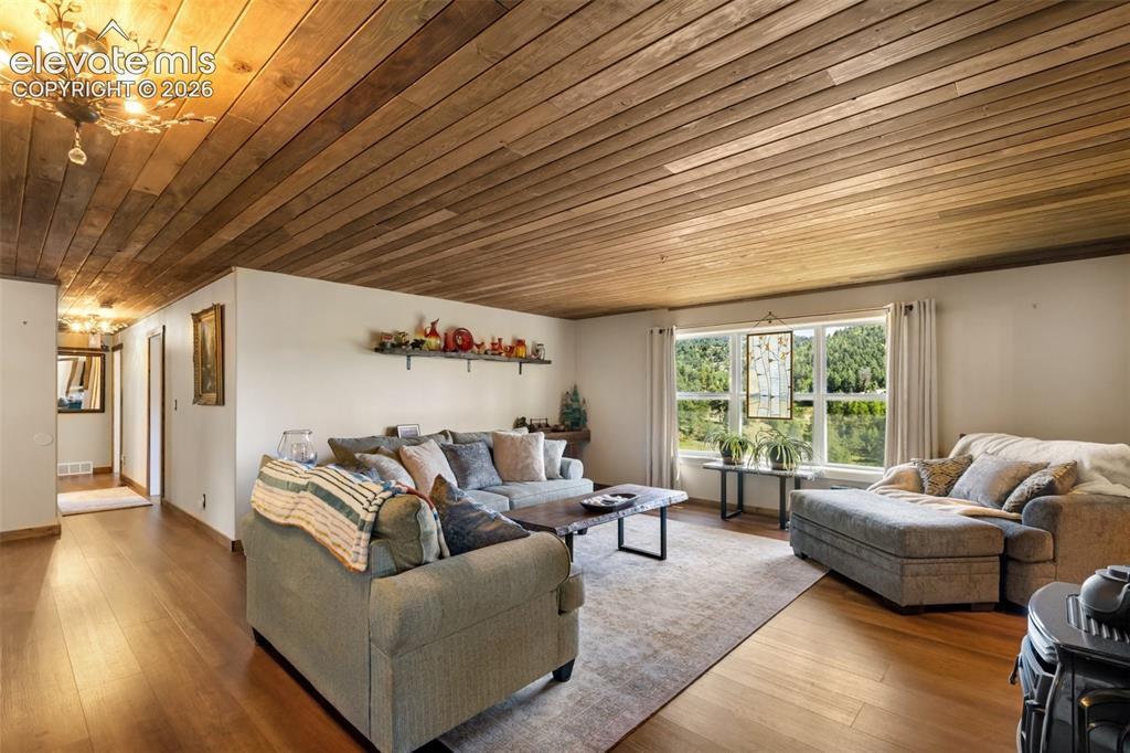 Image 12 of 50: Warm tones and LVP flooring make this home shine.