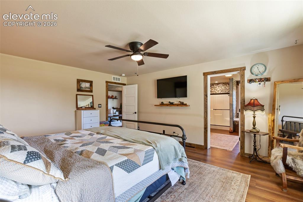 Image 25 of 50: Guest bedroom with attached ensuite bath.