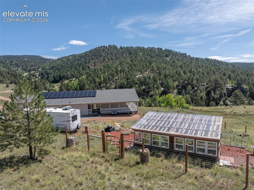 Image 41 of 50: Mountain views with pines and aspens. 