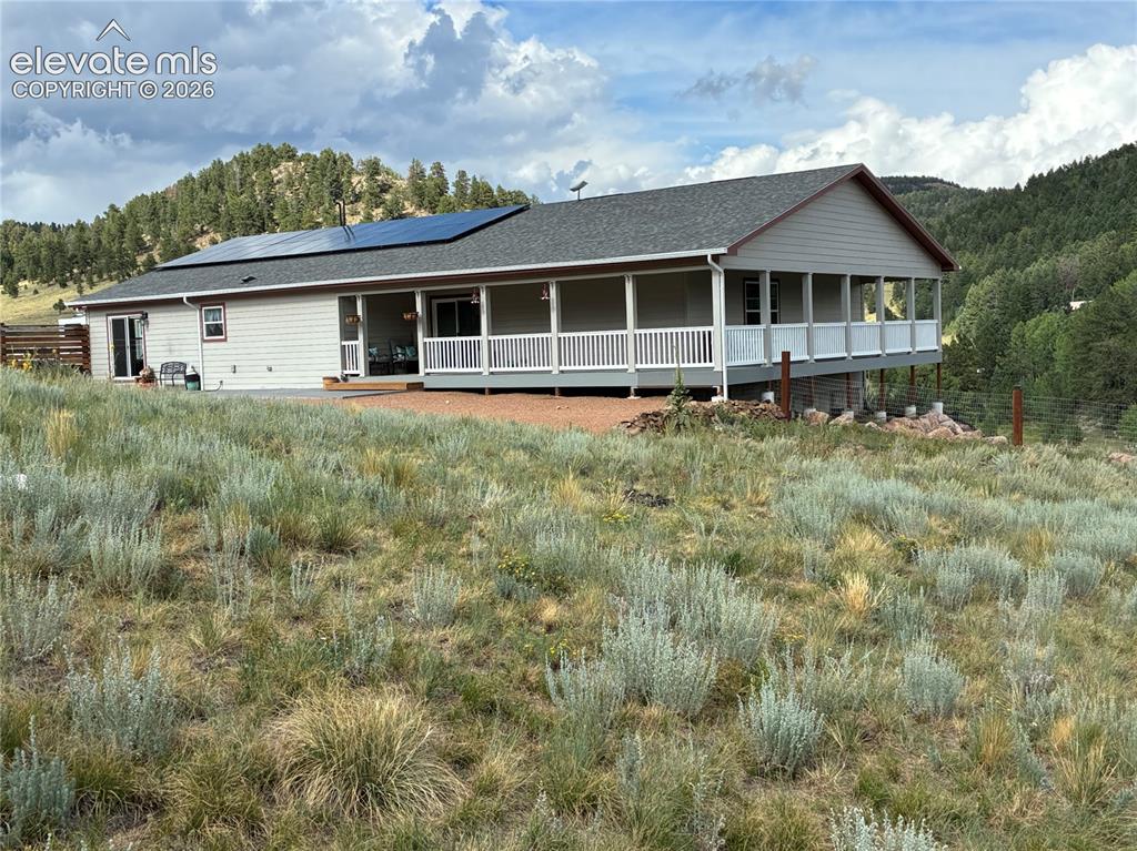 Image 49 of 50: Walk-out from the office onto the covered deck for leisurely afternoons and