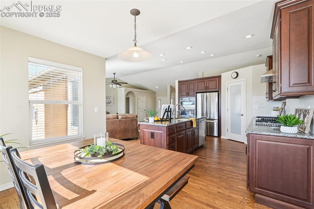Image 12 of 45: The kitchen also has a more casual eat-in space.