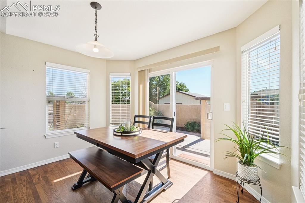Image 13 of 45: The casual dining area is just off the outside patio.
