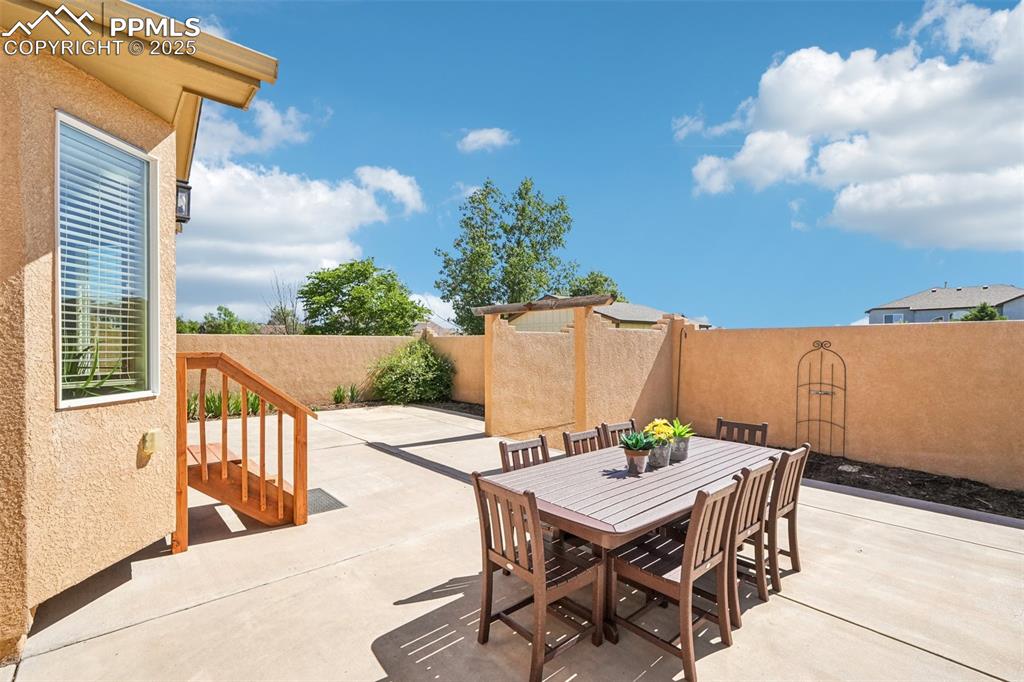 Image 15 of 45: Outside the kitchen is a large enclosed patio area for three-season dining.