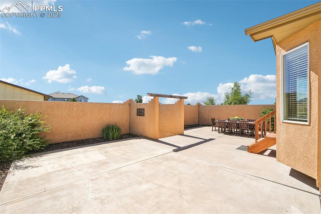 Image 16 of 45: The patio is extended for tons of possibilities - great for a party!