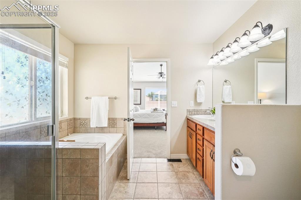 Image 21 of 45: Five-piece primary bathroom.