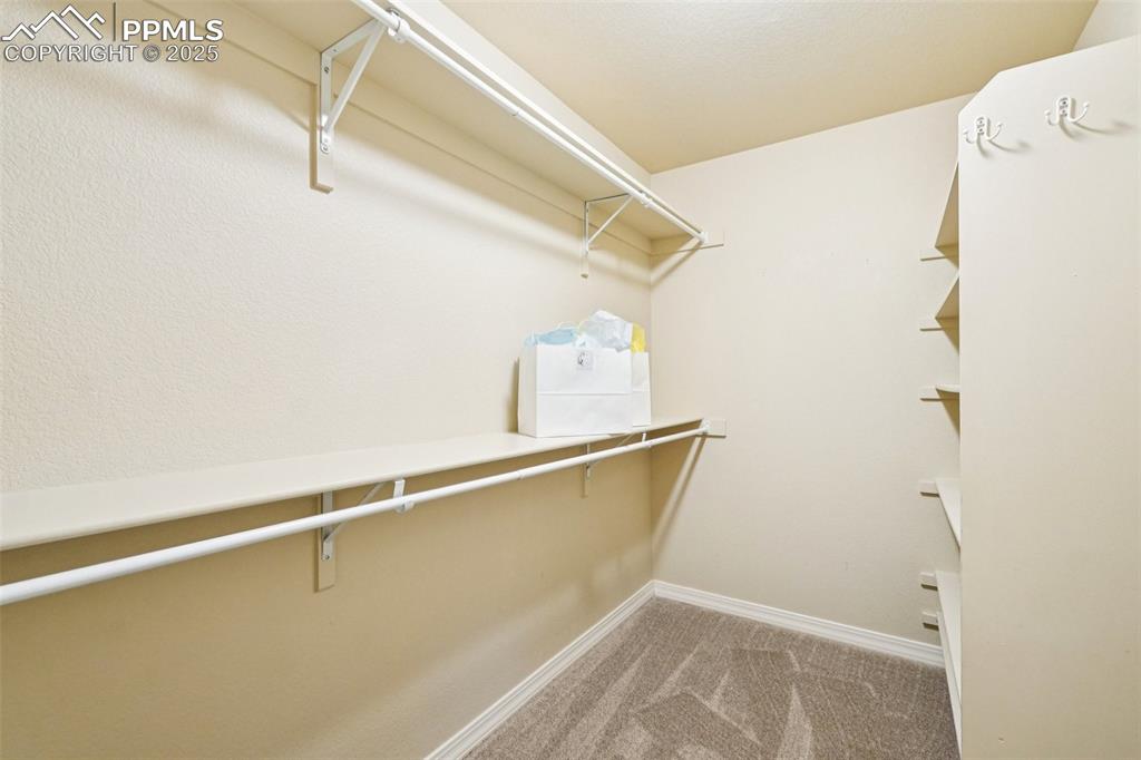 Image 23 of 45: Huge master closet.
