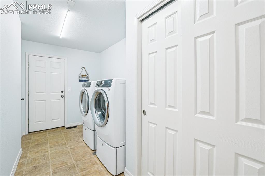 Image 29 of 45: Laundry room is on the way to the 3-car garage.