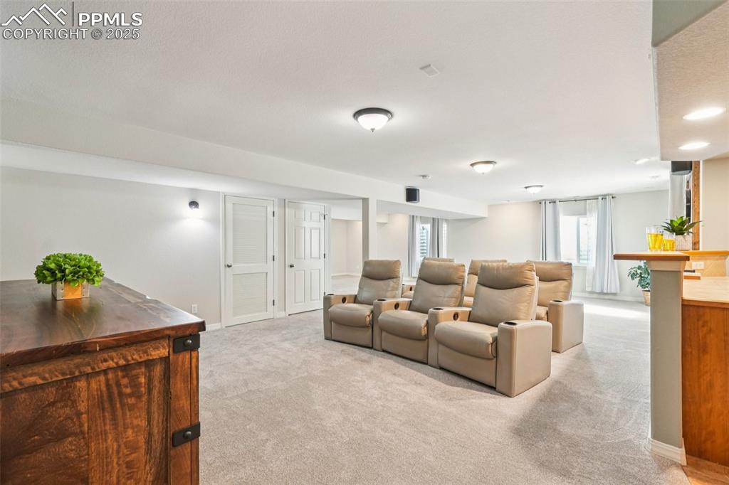 Image 31 of 45: A portion of the basement has been set up as a theater room.