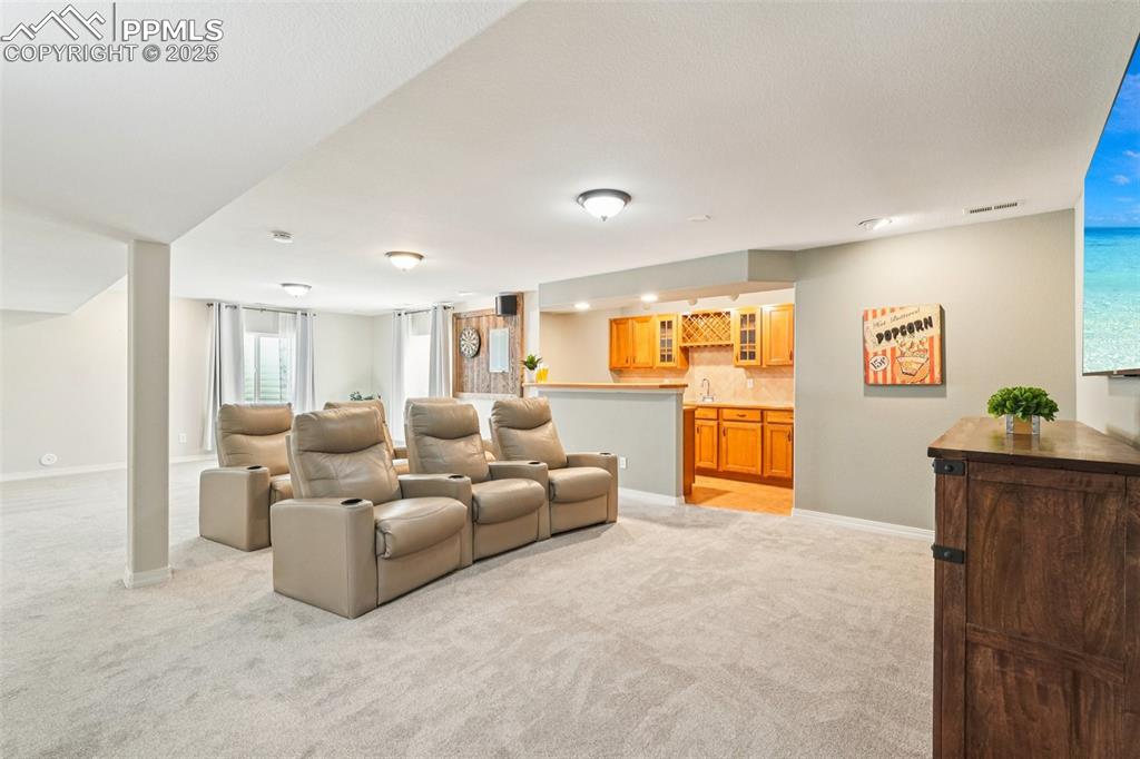 Image 33 of 45: This theater area is right off the wet bar.
