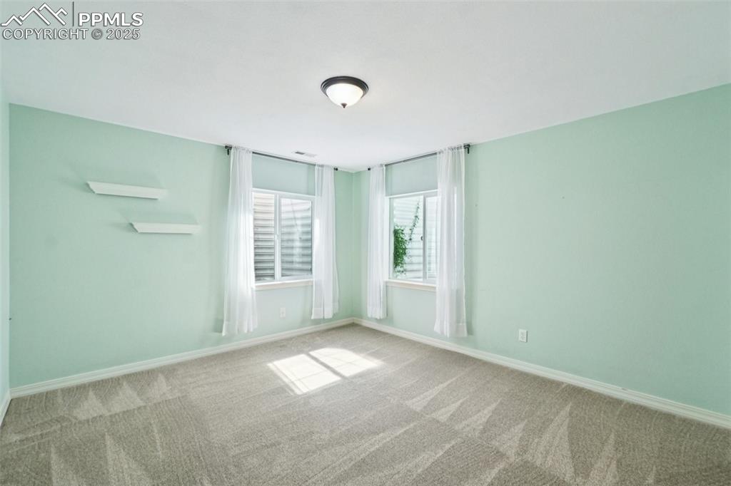 Image 35 of 45: In addition to a huge living area there are three bedrooms in the basement.