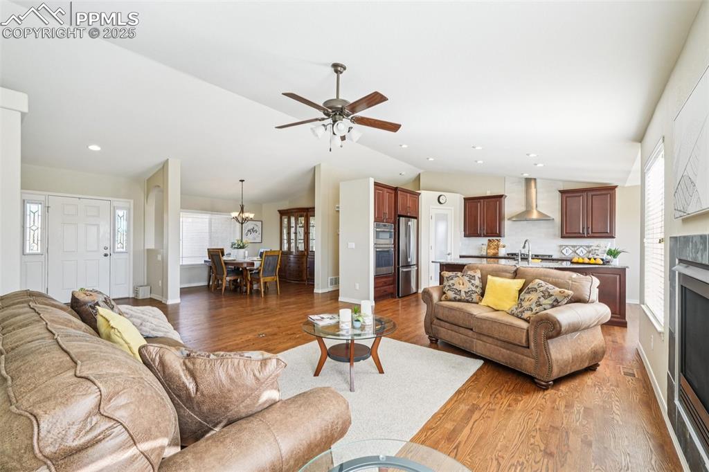 Image 6 of 45: The living room focuses around an attractive, updated gas fireplace.