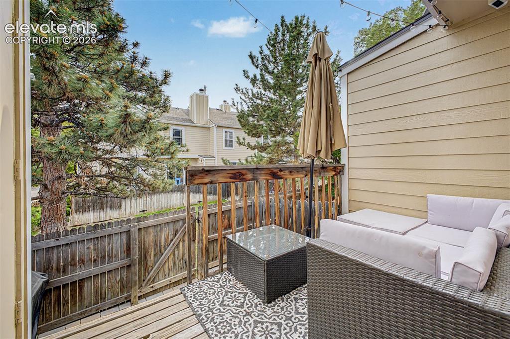 Image 32 of 42: Private deck space featuring wood decking, wood railing, and vinyl siding