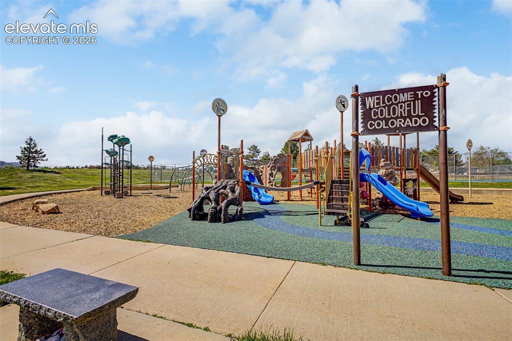 Image 39 of 42: Playground featuring multiple slides, climbing structures, and a dedicated