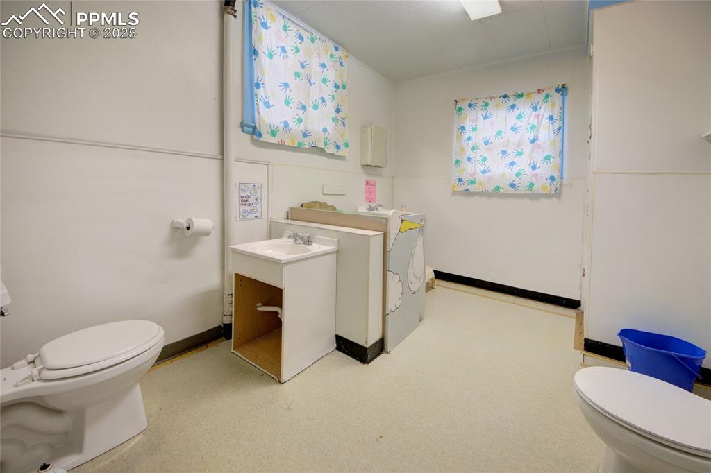 Image 3 of 34: Bathroom with toilet and vanity