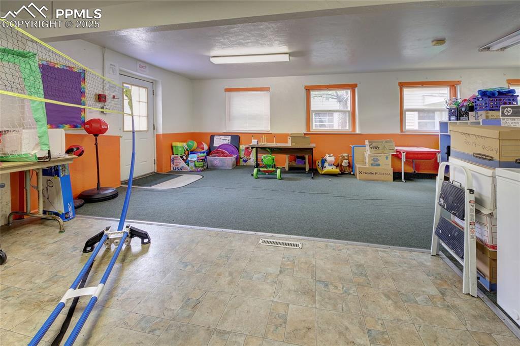 Image 4 of 34: Recreation room featuring washer / dryer