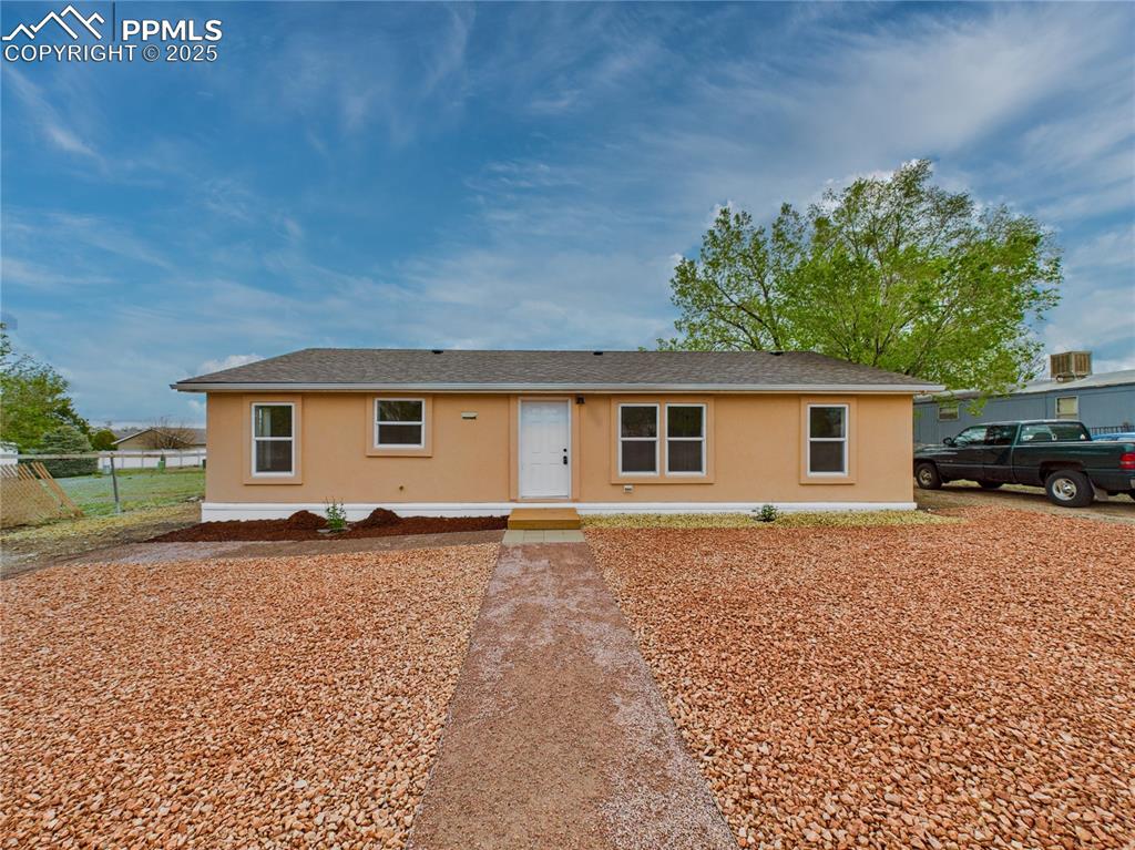 Image 39 of 44: Beautifully landscaped front yard with great curb appeal