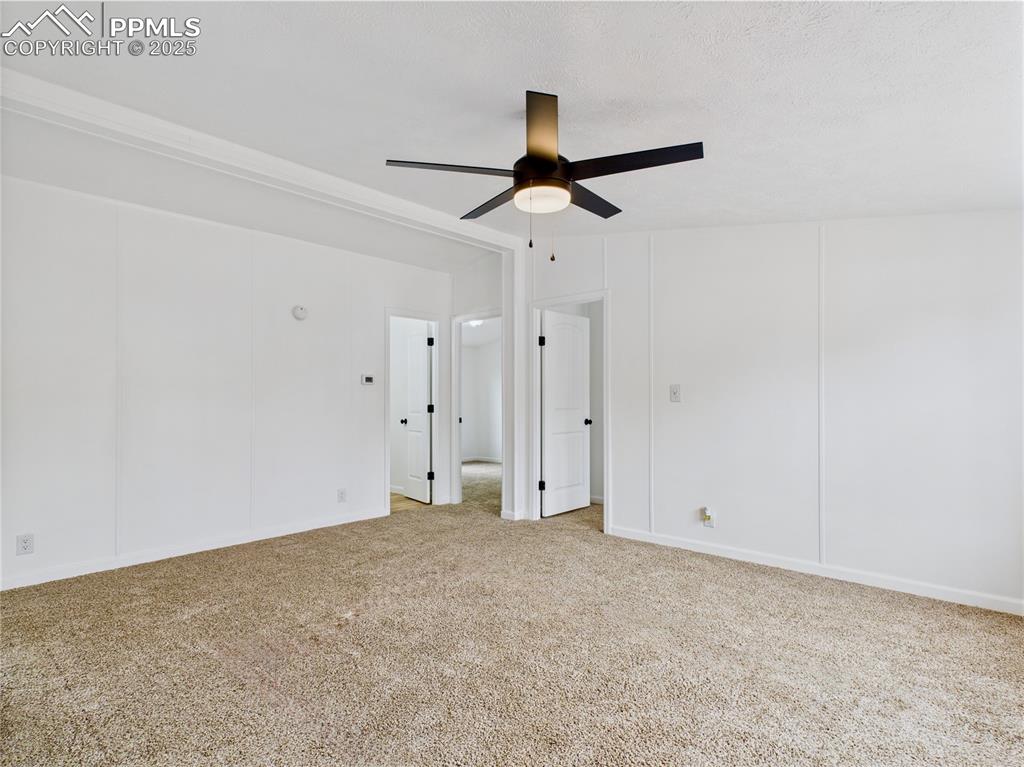 Image 4 of 44: Comfortable living room with ceiling fan and built-in light for added ambia