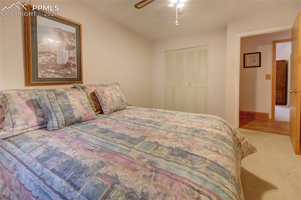Image 20 of 33: Neutral wall color with wall-to-wall carpeting