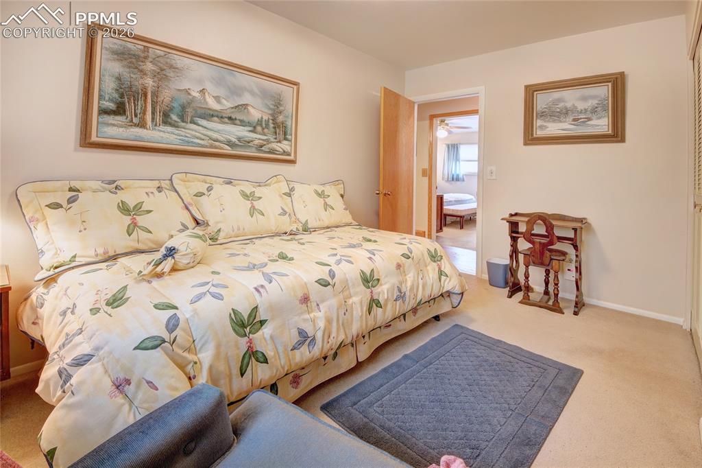 Image 21 of 33: Neutral-toned walls complement the light-colored carpeting