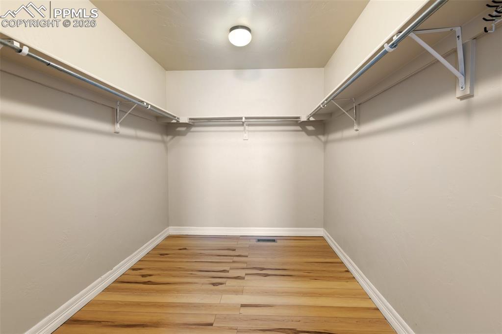 Image 21 of 45: Generous walk-in closet with room for all of your essentials