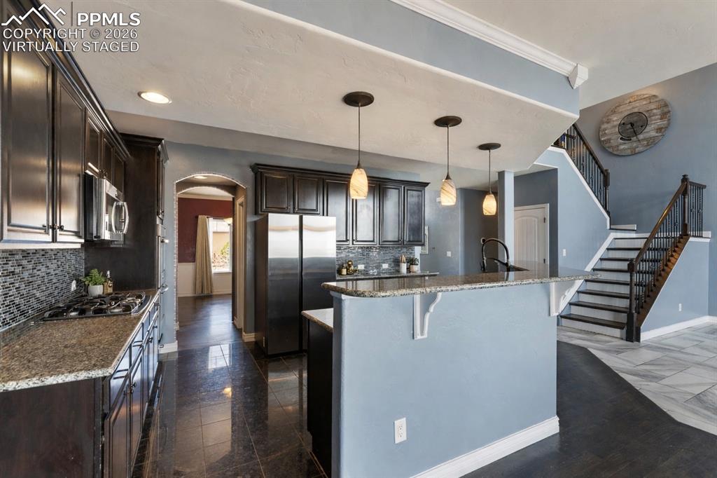 Image 3 of 45: Open kitchen with plenty of prep space (Virtually Staged)